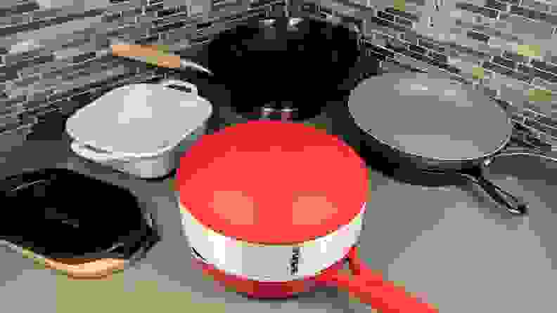 Assorted cooking pans on top of kitchen counter.