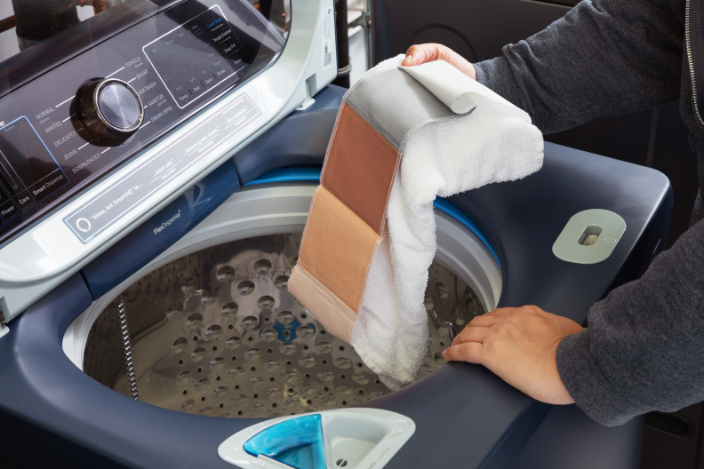 Loading laundry into a top-load washing machine