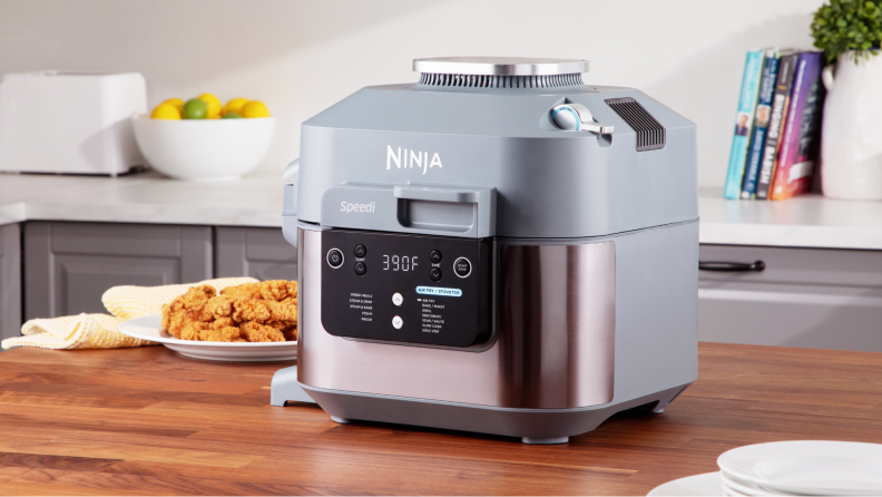 The Ninja Speedi air fryer sitting atop a kitchen island.