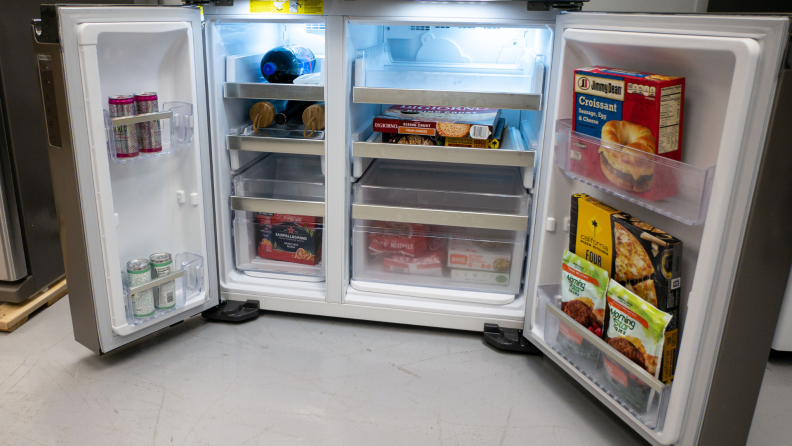 the bottom section of a refrigerator stands open